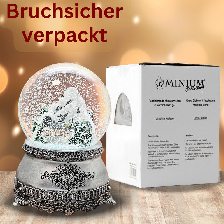 Nostalgische Schneekugel Berglandschaft mit Brücke auf Zinnsockel 100 mm Durchmesser mit Spieluhr